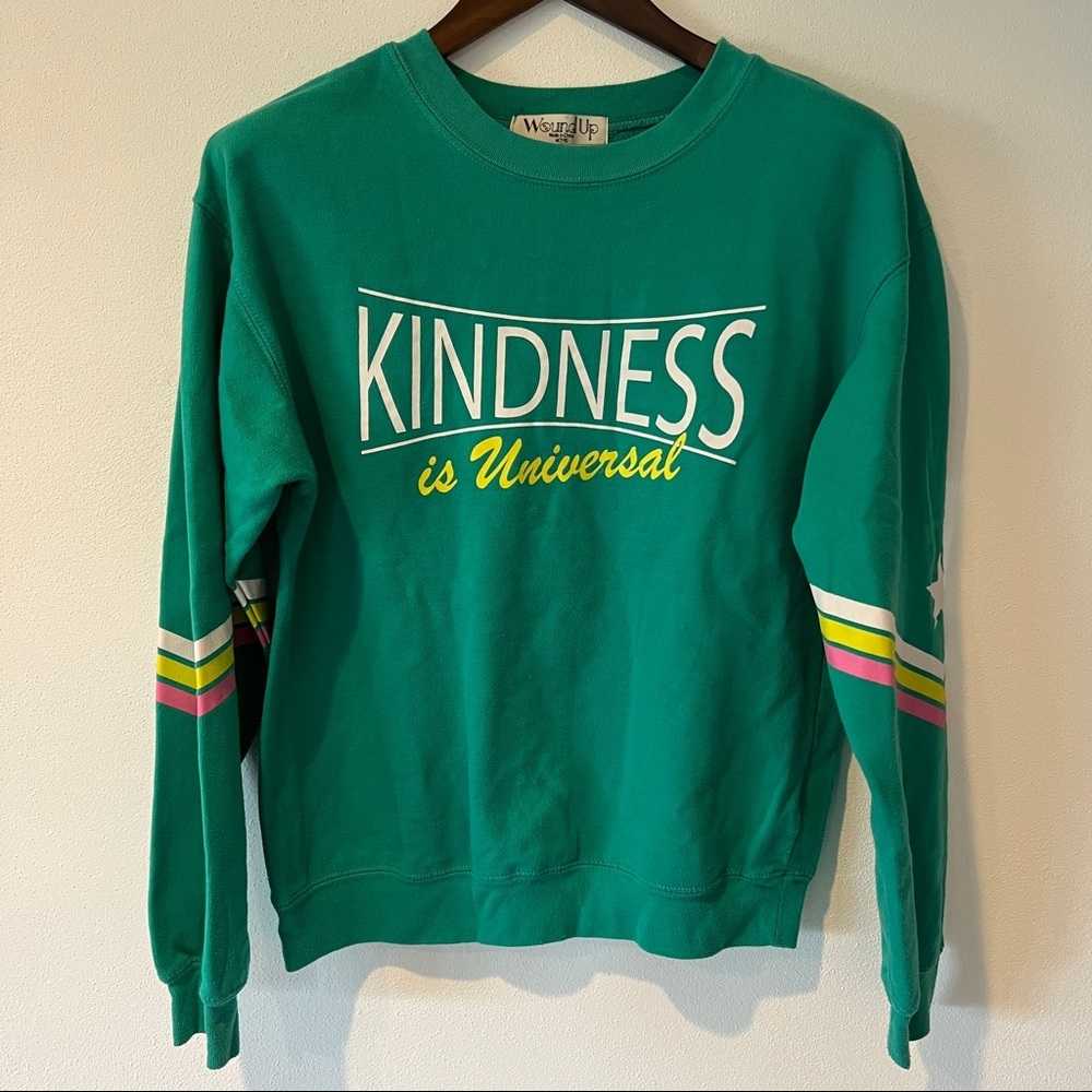 Wound Up Kindness is Universal Star Elbow Graphic Crew Neck Sweatshirt - Picture 1 of 7